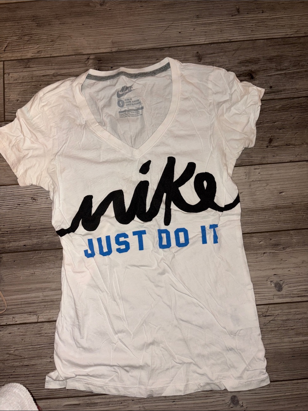 Nike White V-Neck Graphic Tee with Black Script and Blue Text